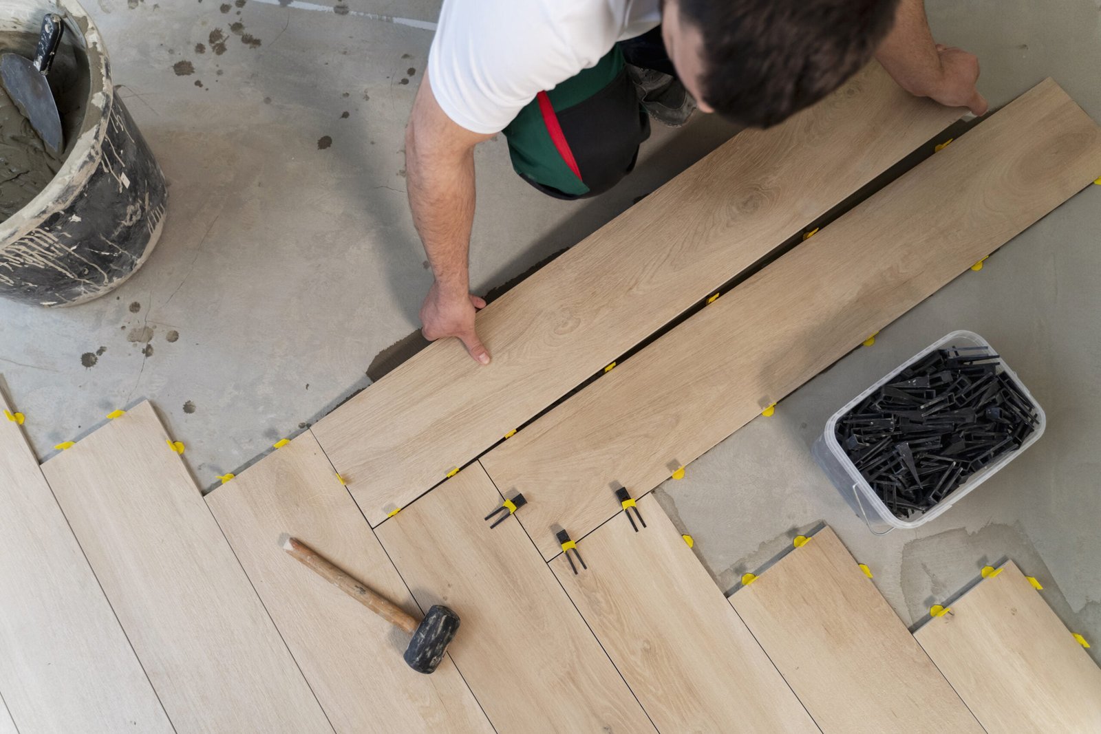 top-view-man-tiling-floor